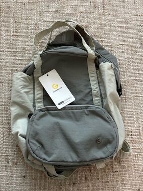 Glowmode gray backpack with detachable pouch and separate zip strap